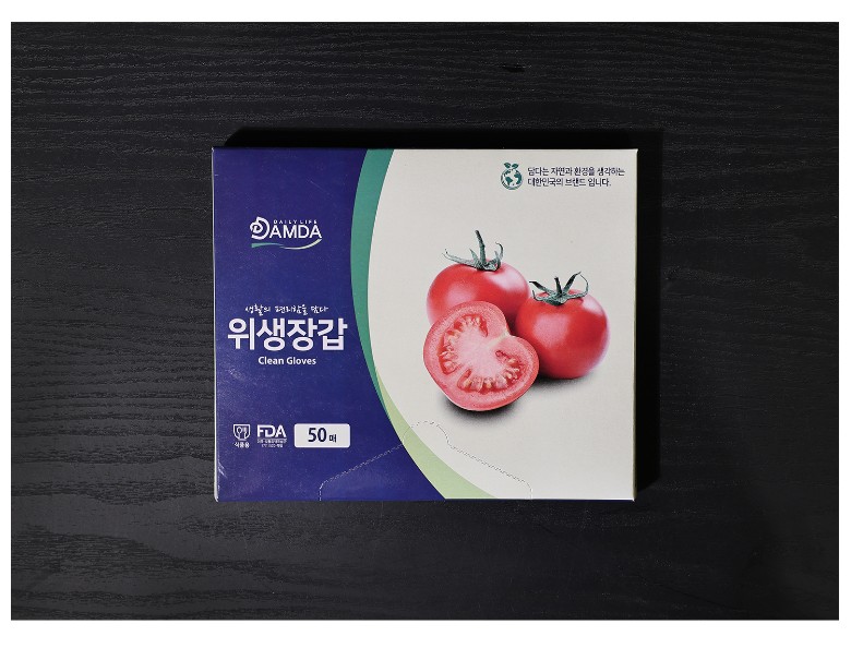 토마토 이미지를 활용한 패키지 디자인이 돋보이며, 위생장갑 제품명이 깔끔하게 인쇄된 모습